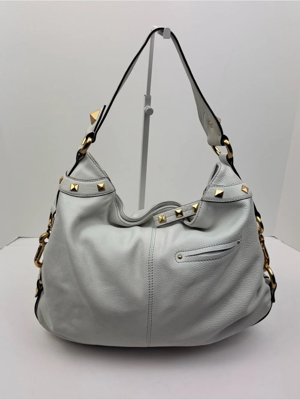 B. Makowsky Leather Ivory Hobo handbag. Gold-tone stud accent hardware.